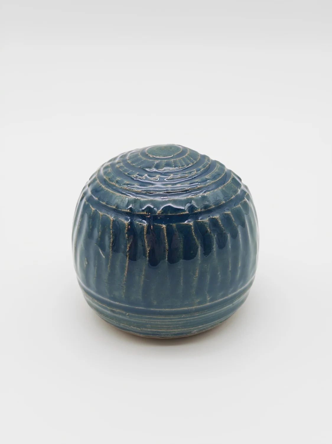 Blue salt dish with a rounded opening and carved vertical lines, view 2