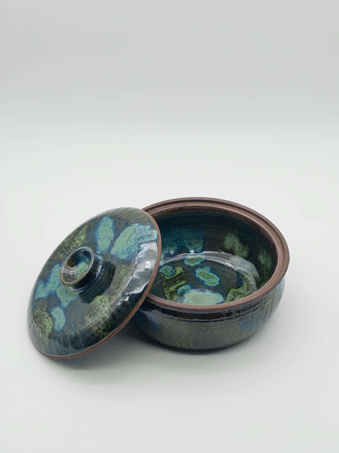 Blue and green lidded jar with a patterned interior, view 3