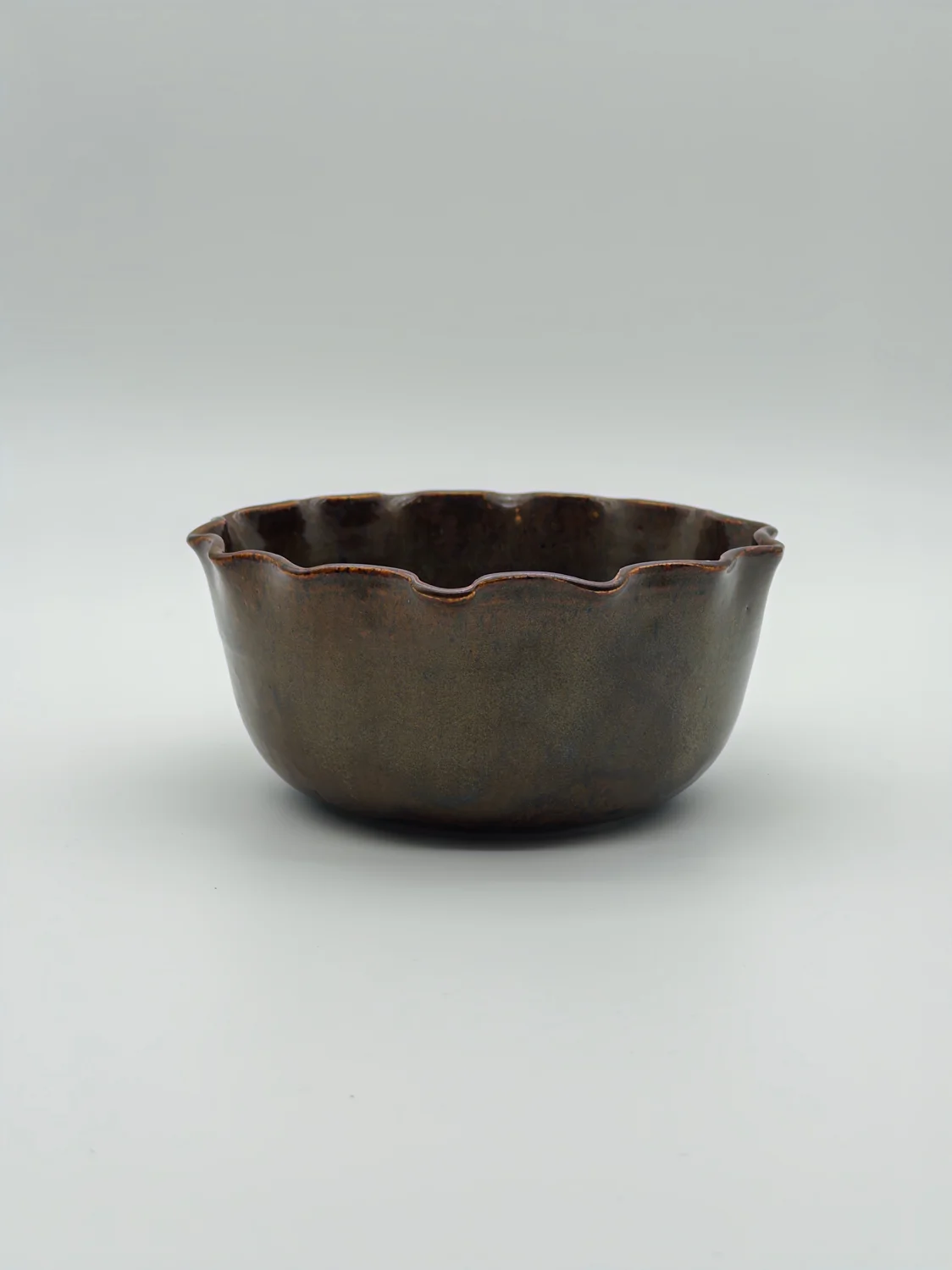 Small olive-brown bowl with a scalloped rim, view 2